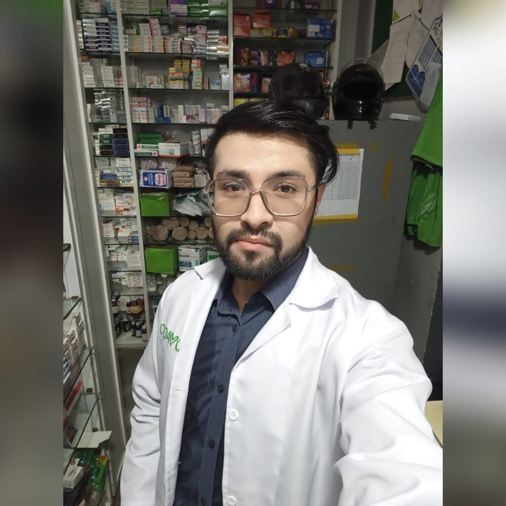 Dr. Hasnain Siraj Memon wearing a lab coat at Dvago Pharmacy